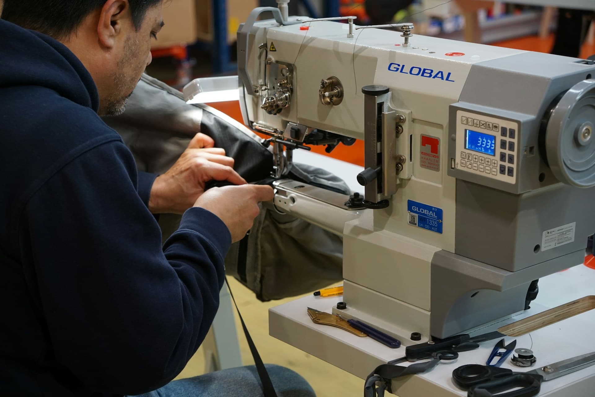 Stitching a panel on the machine line